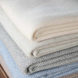 Sofia Toscano cream throw blanket in recycled wool and cashmere, brushed finish and fringed ends