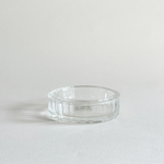 Florentine cut crystal ashtray with ribbed edge, catching the light around the rim