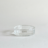 Florentine cut crystal ashtray with ribbed edge, catching the light around the rim