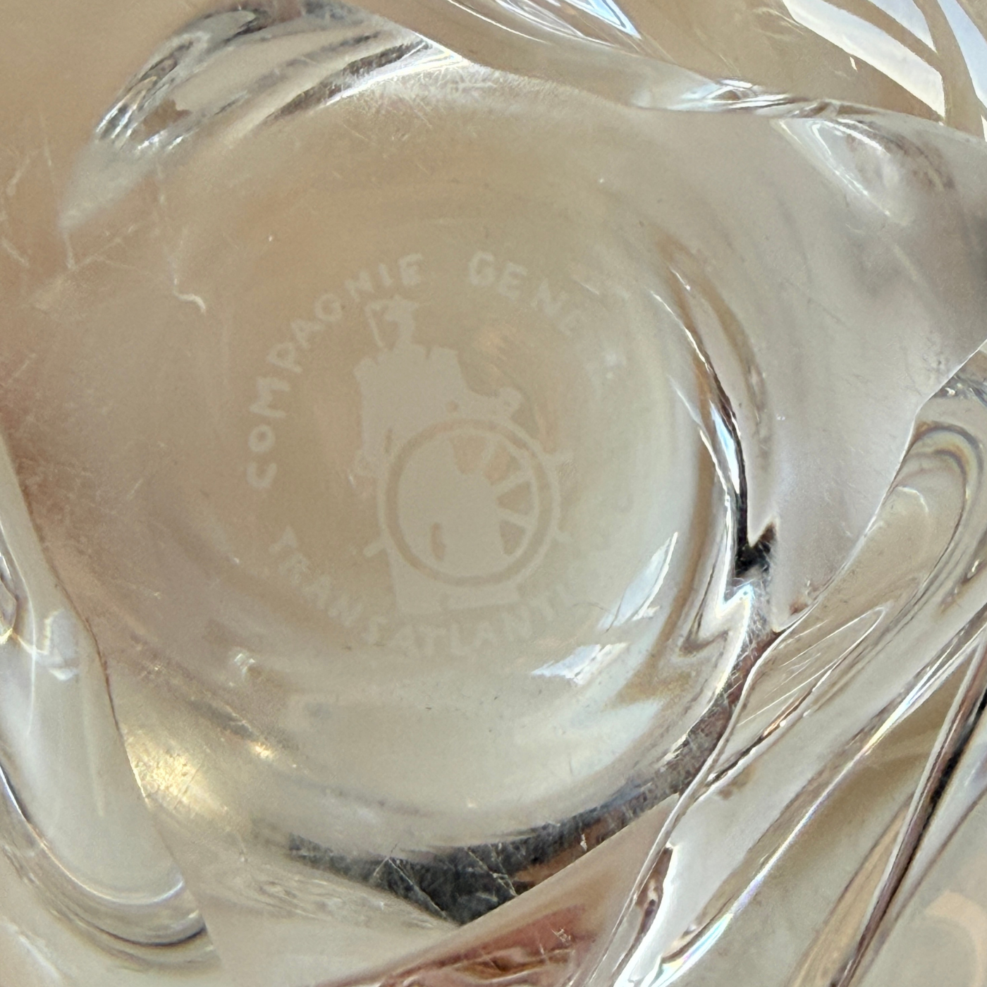 Close-up of etched French Line hallmark on Saint-Louis crystal