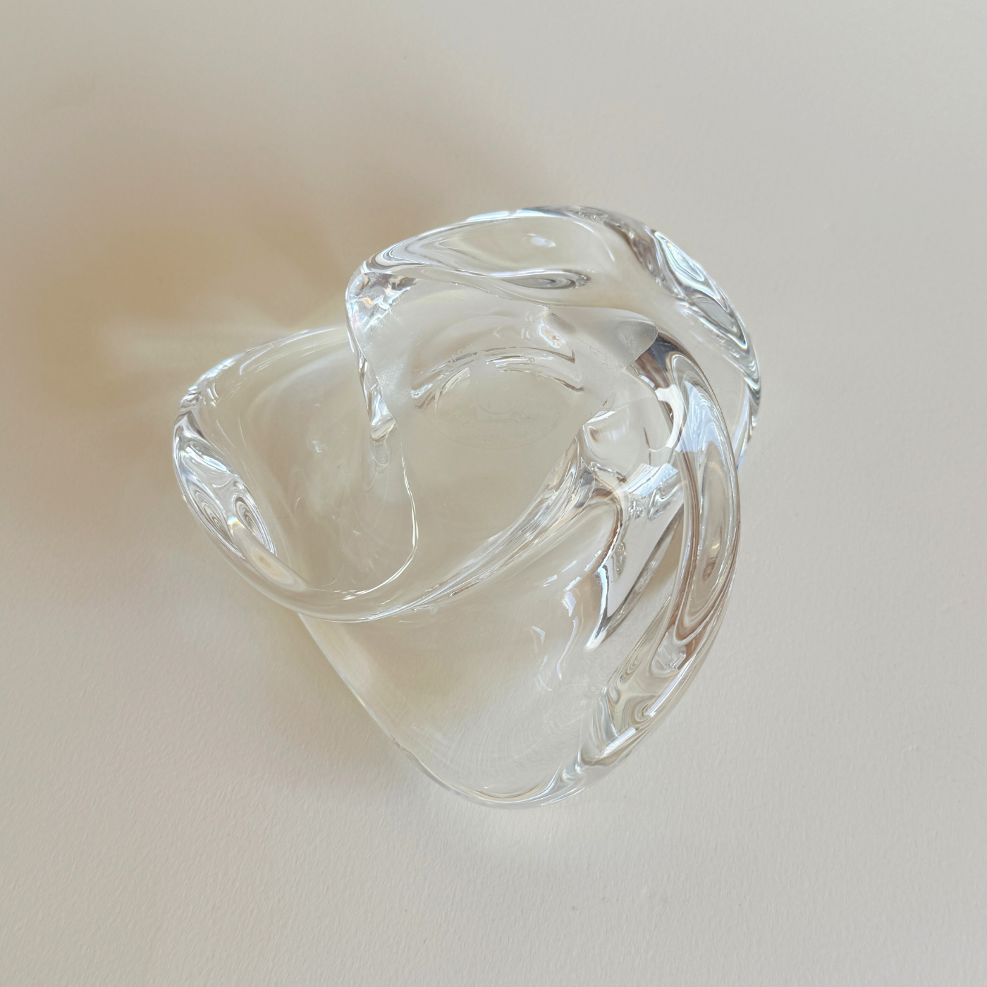 Heavy sculptural mid-century Saint-Louis ashtray on display