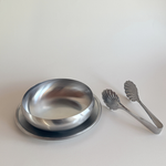 Inoxpran 1970s stainless steel bowl, plate, and tongs set