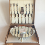 Close-up of Morinox logo on cake stand with minor scratches