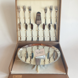 Close-up of Morinox logo on cake stand with minor scratches