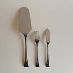 Elegant mid-century Morinox cake set styled for table display