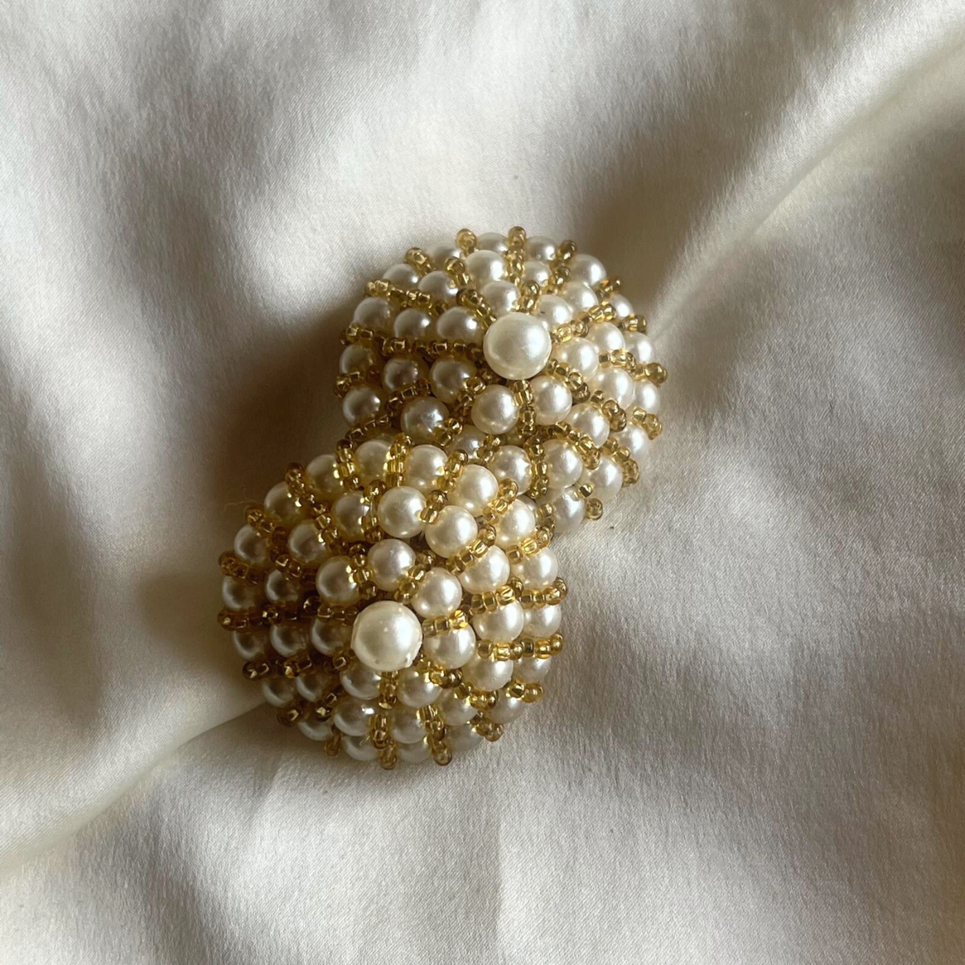 Close-up of vintage faux pearl pyramid detail