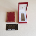 Cartier Gun à Lignes table lighter, silver stainless steel and gold-plated stripes, side profile