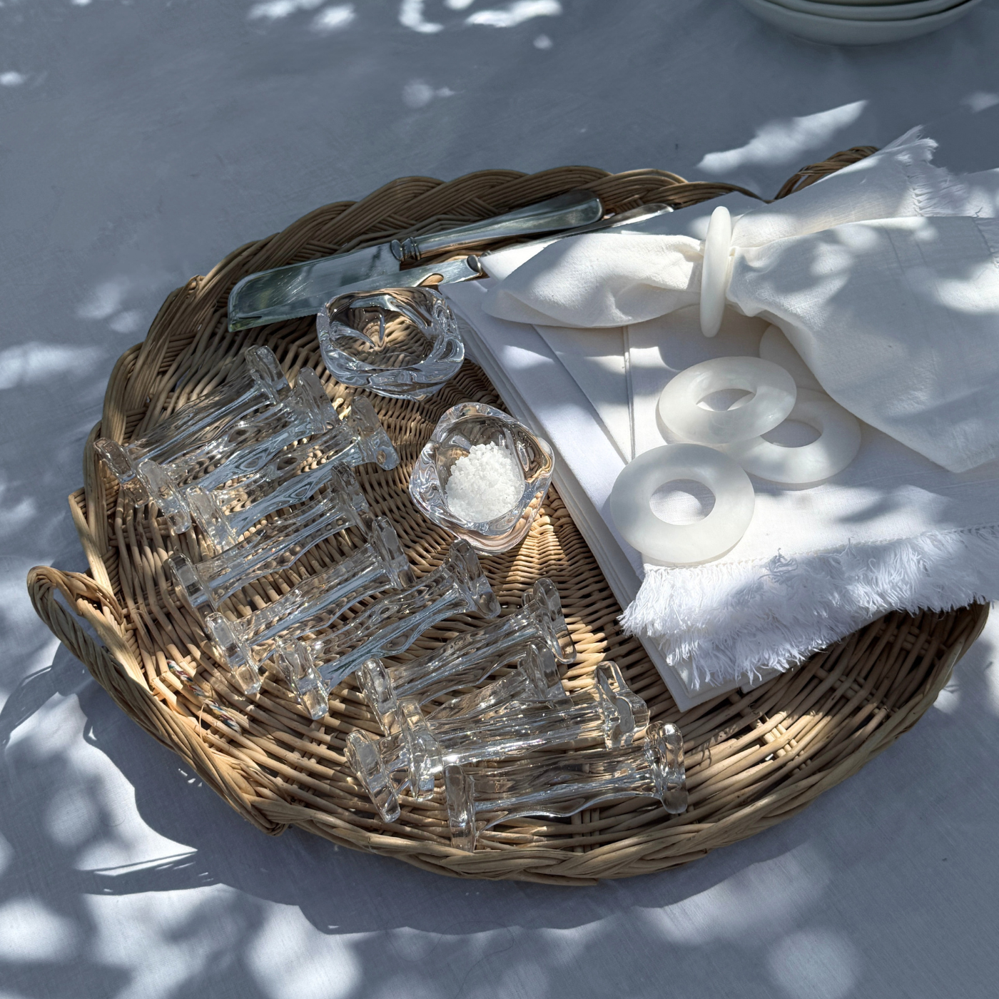 Pair of French crystal cutlery rests with thorn-inspired details on a wooden surface