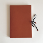 Prada Saffiano leather notebook in burnt orange, A5 size with cross-hatch pressed calf leather cover