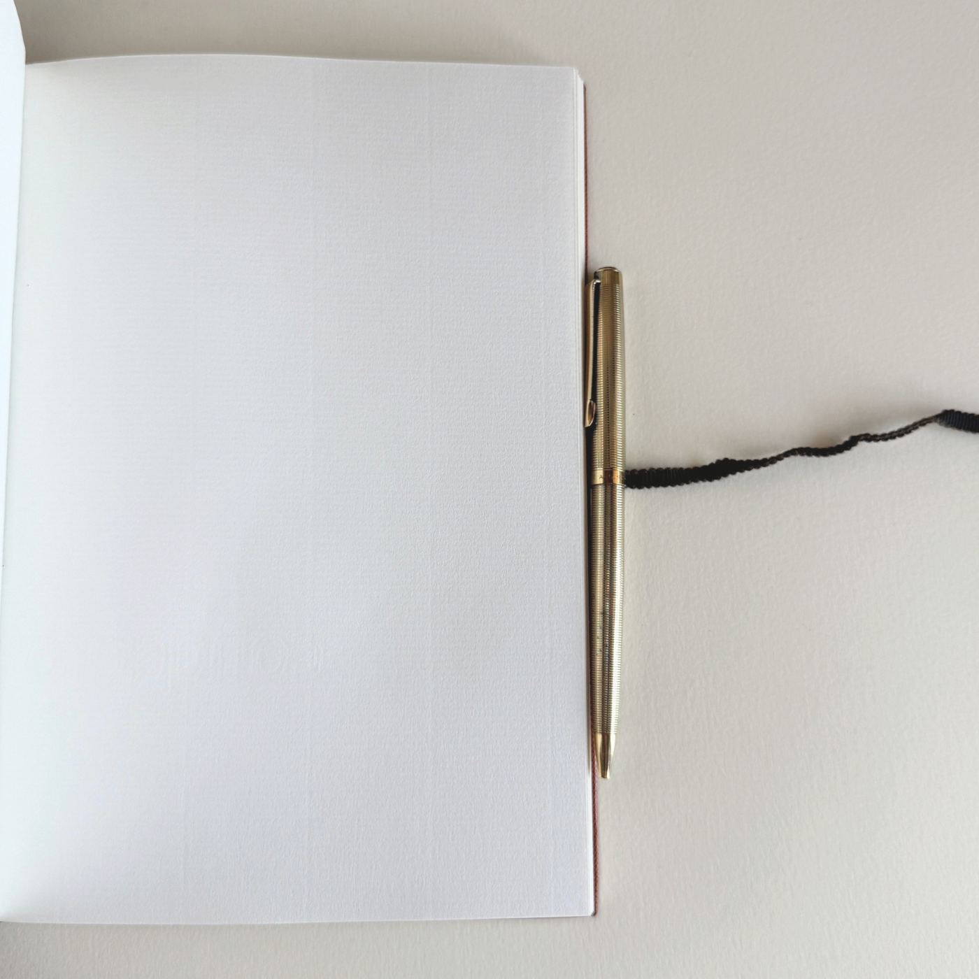 Prada A5 notebook in orange Saffiano leather, textured cross-hatch finish with 126 pages