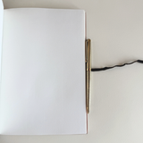 Prada A5 notebook in orange Saffiano leather, textured cross-hatch finish with 126 pages