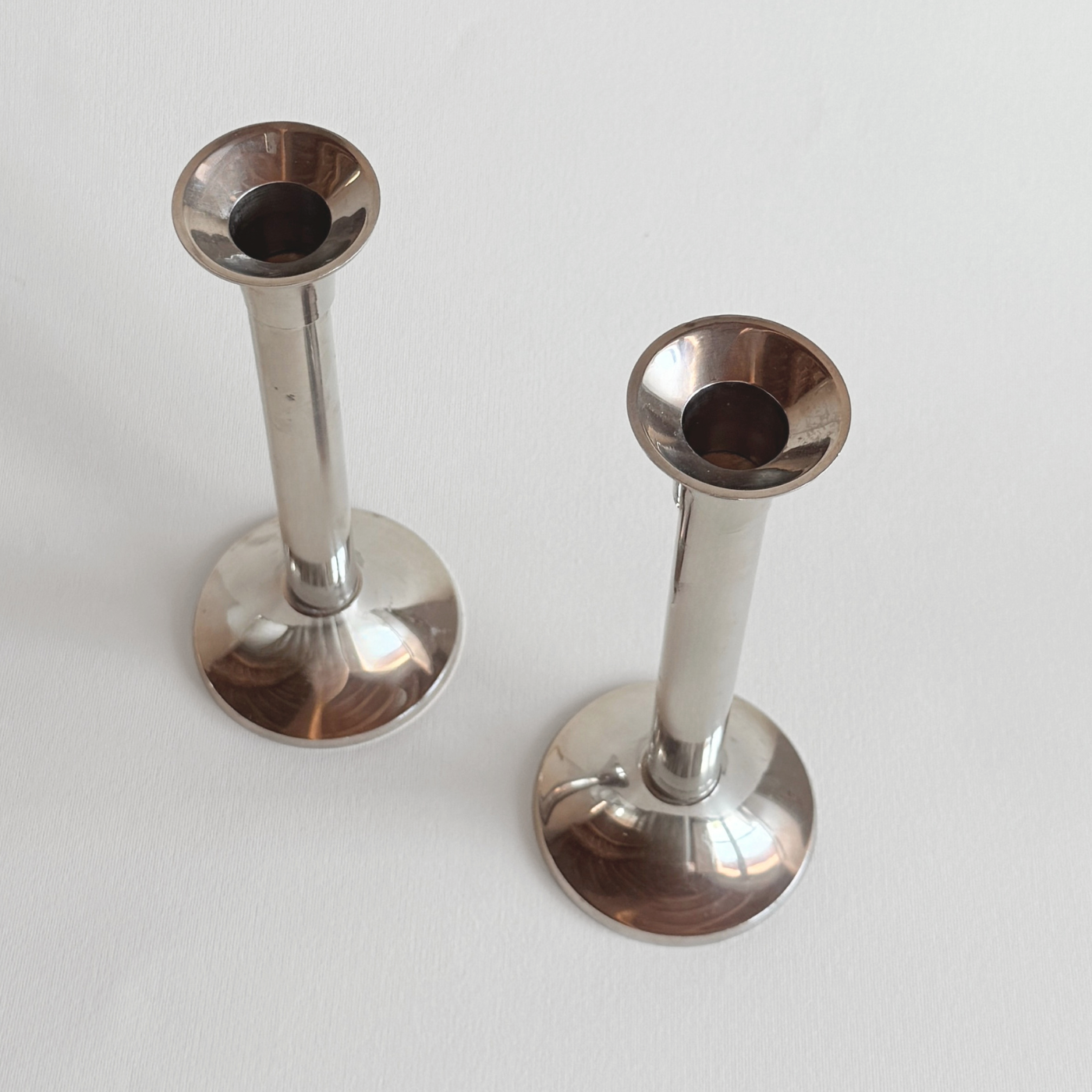 Polished stainless steel candle holders, 1970s French vintage steel tableware, L'Officina General Store