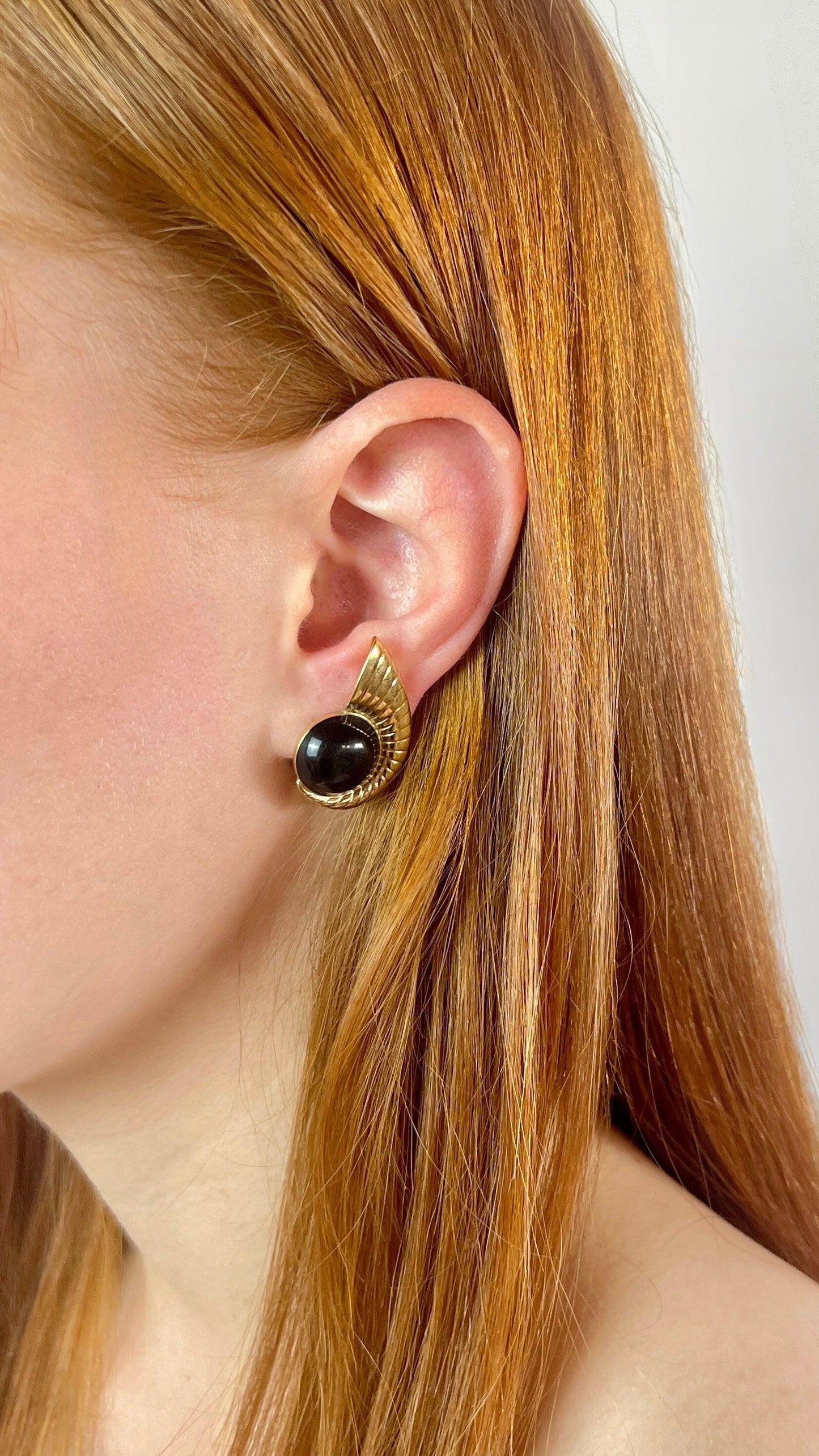 Black and golden earrings