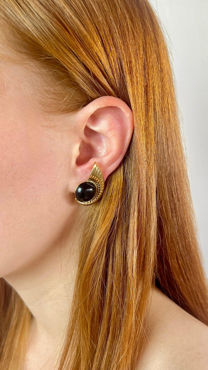 Black and golden earrings