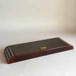 Tortoiseshell Lucite games set open, showing two card decks, poker dice and ivory and brown chips