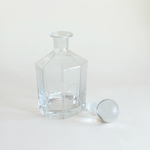 Faceted hexagonal glass decanter in clear crystal with heavy sphere stopper for spirits