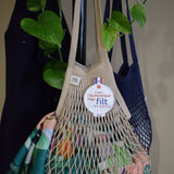 Close detail of mastic knitted cotton mesh and braided handle on a Filt 1860 French net bag