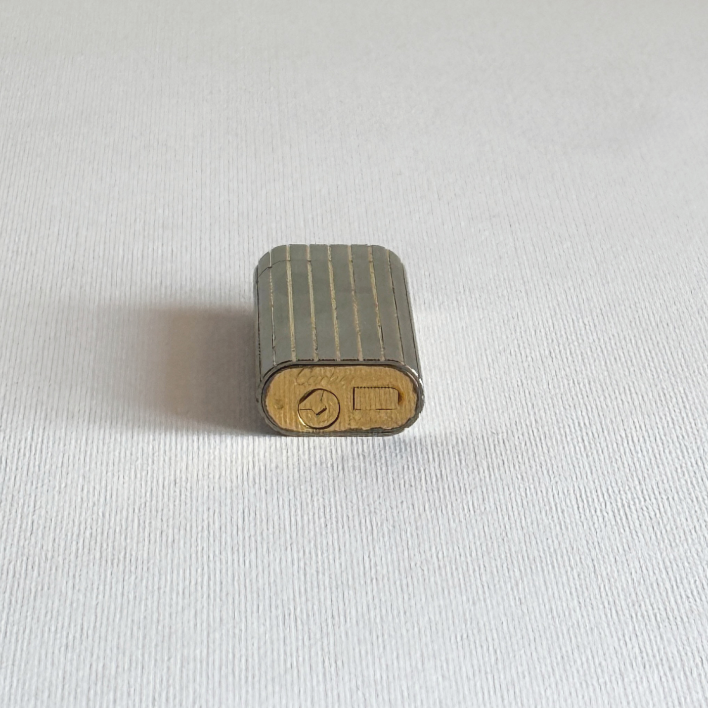 1980s Swiss Cartier table lighter in silver stainless steel and gold plate, with its original box