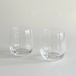 Pair of ribbed crystal tumblers with vertical fluting catching the light
