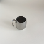 Vintage IMCO stainless steel creamer jug, side view