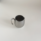 Vintage IMCO stainless steel creamer jug, side view