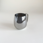 IMCO 1970s Italian creamer in polished steel, pouring lip detail