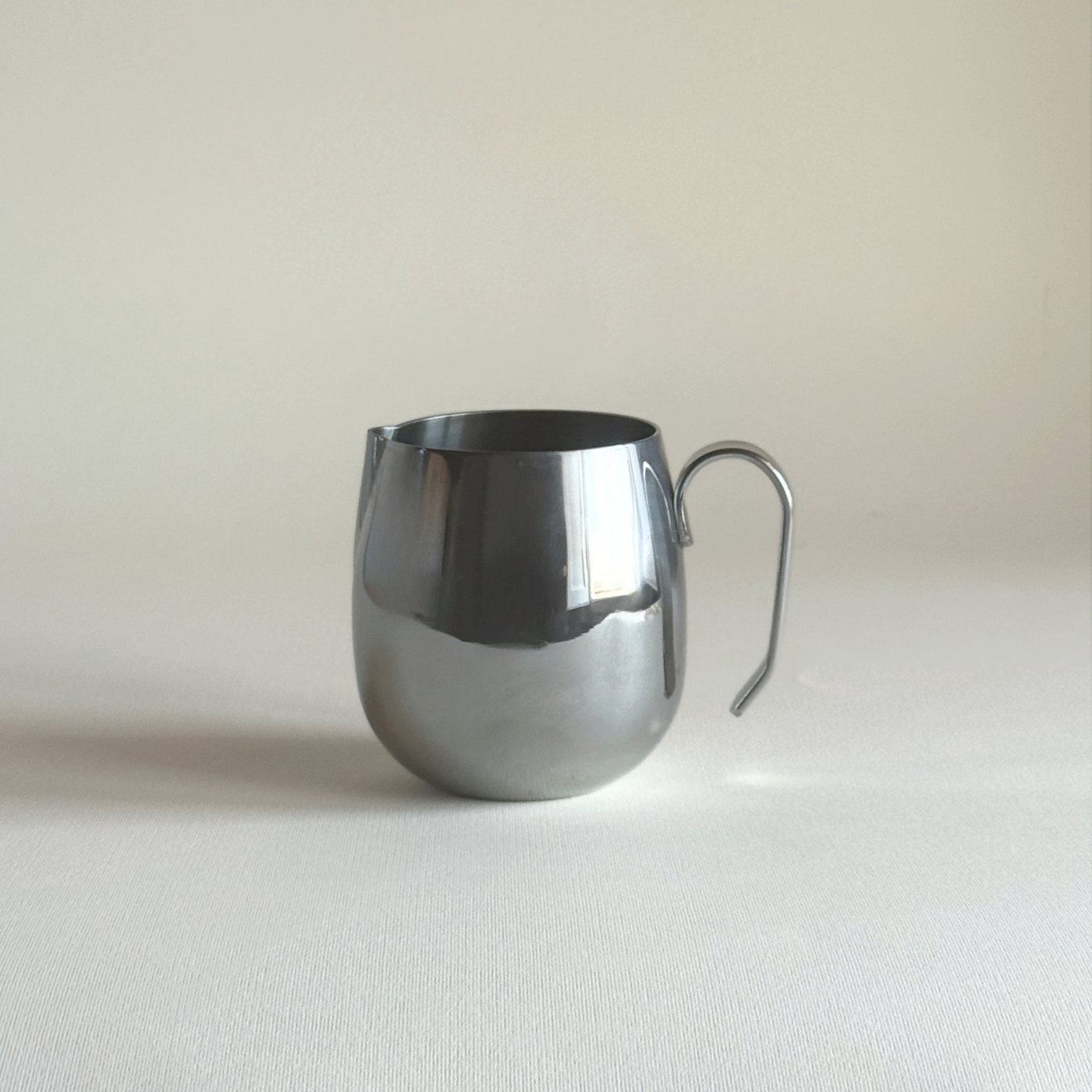 IMCO polished stainless steel creamer, 1970s Italian space-age design