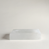 White alabaster soap dish styled on minimalist bathroom sink
