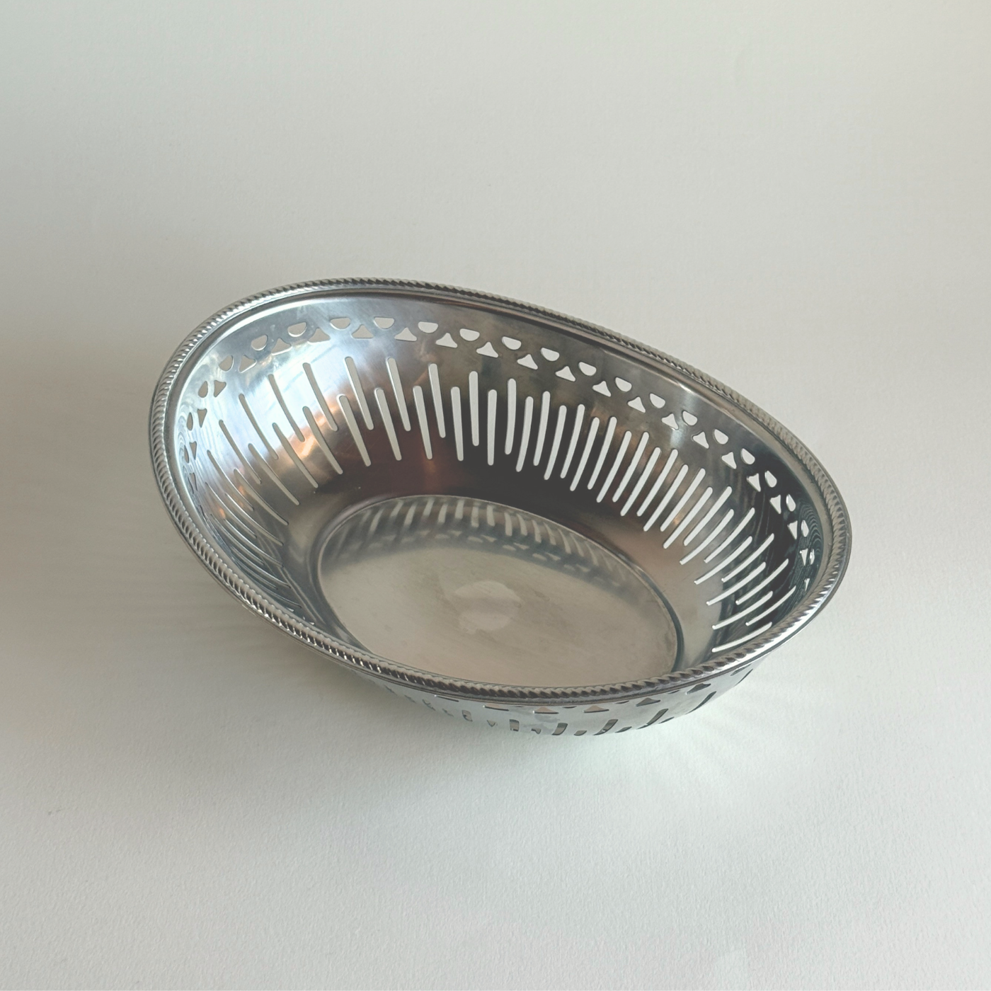 Alessi Mercurio silver stainless steel bread basket, open low profile Italian table centrepiece