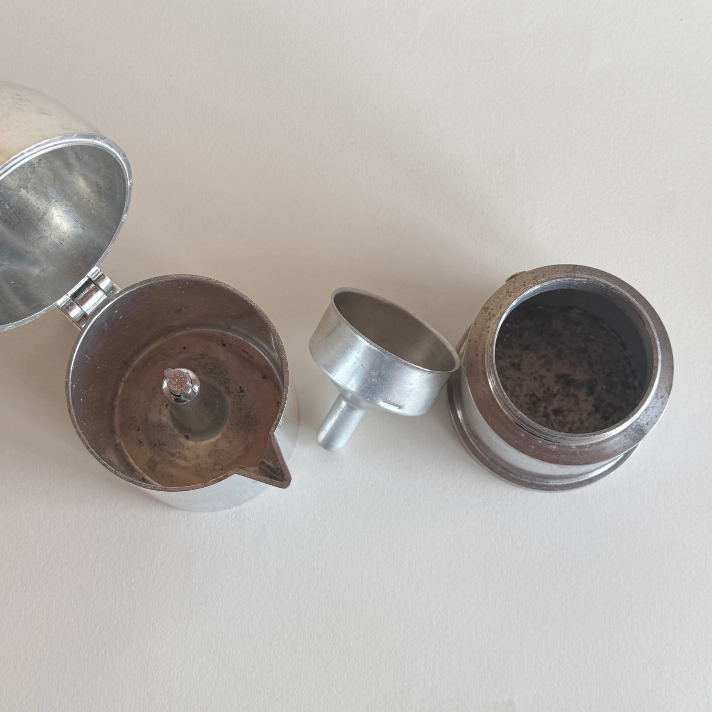 Interior of aluminium moka pot with replaced filter and gasket