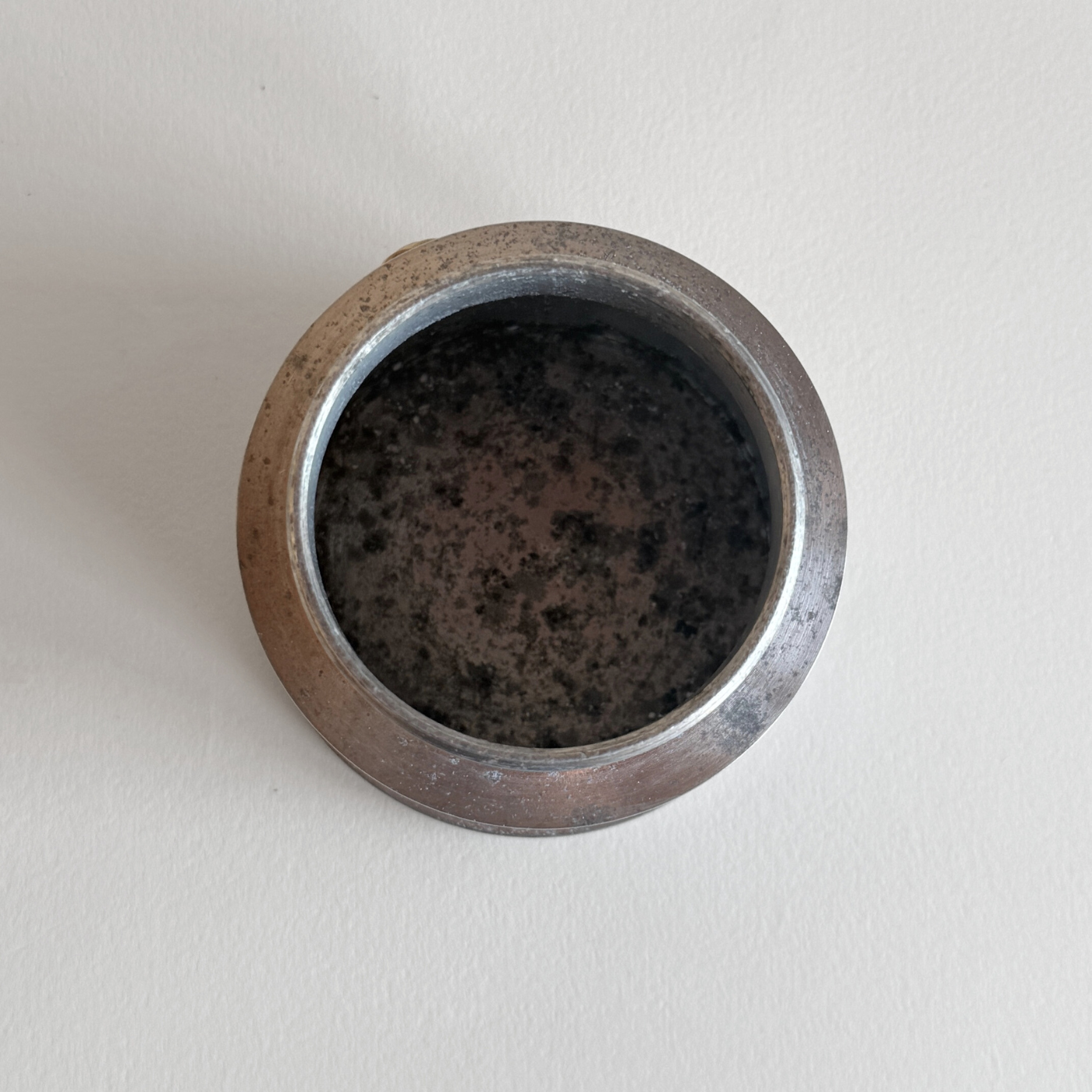 Interior of aluminium moka pot with replaced filter and gasket