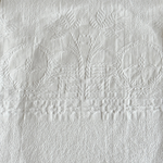 Full view of the antique jacquard cotton hand towel with scalloped borders