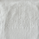 Full view of the antique jacquard cotton hand towel with scalloped borders