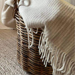 Beige Sustainable Wool and Cashmere Throw made in Italy from recycled cashmere inside basket
