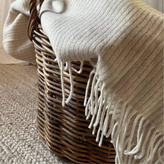 Beige Sustainable Wool and Cashmere Throw made in Italy from recycled cashmere inside basket