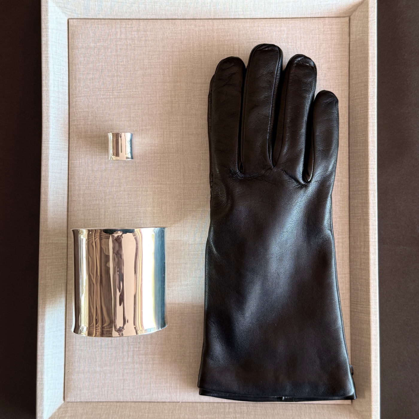 pair of women leather gloves black made in italy cashmere lined and silver ring with silver cuff bracelet