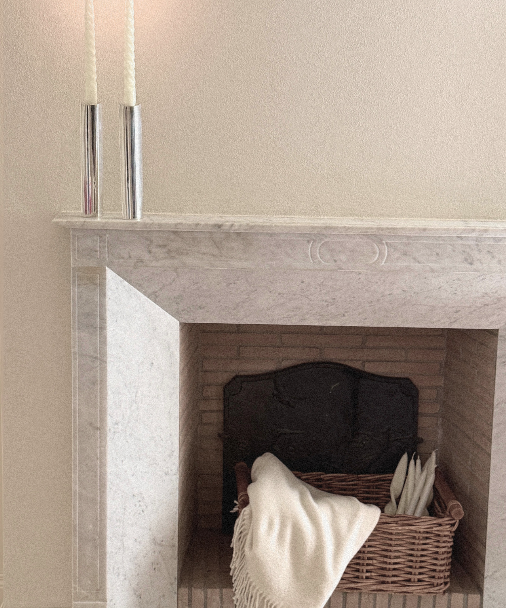 Silver Plated Candle Holders in polished silver-tone metal, tall cylindrical forms holding slender ivory taper candles.