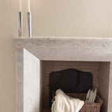 Silver Plated Candle Holders in polished silver-tone metal, tall cylindrical forms holding slender ivory taper candles.