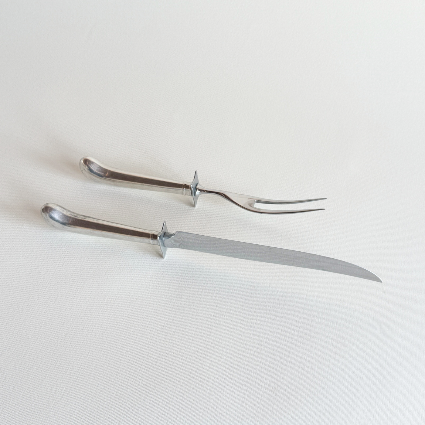 Silver-plate carving set styled for serving a roast, pre-loved tableware