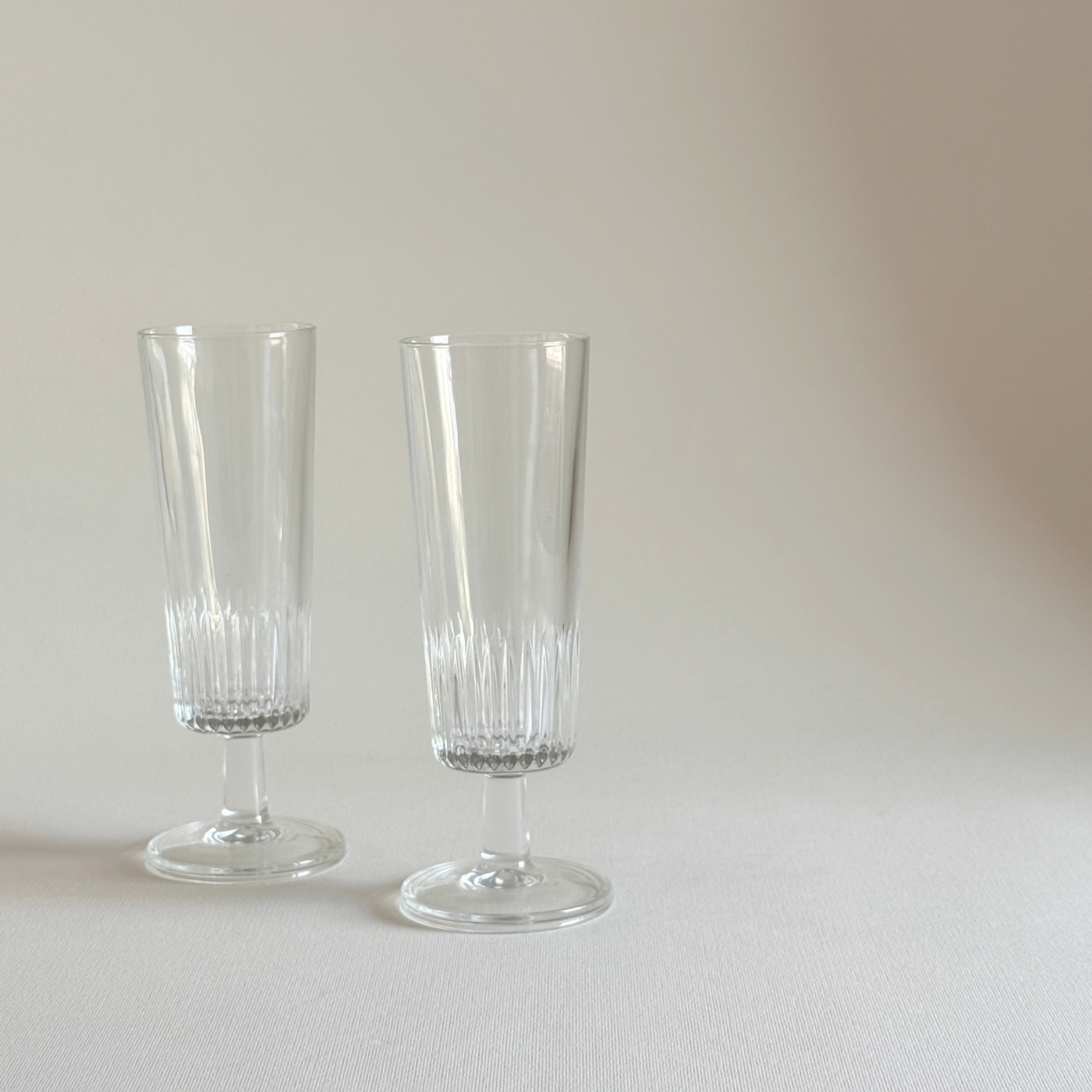 Glass Champagne Flutes, set of two clear glass glasses with vertical ribbed detailing and slender stems