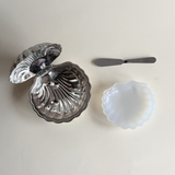 Pre-loved silver butter dish with discolouration and corrosion detail