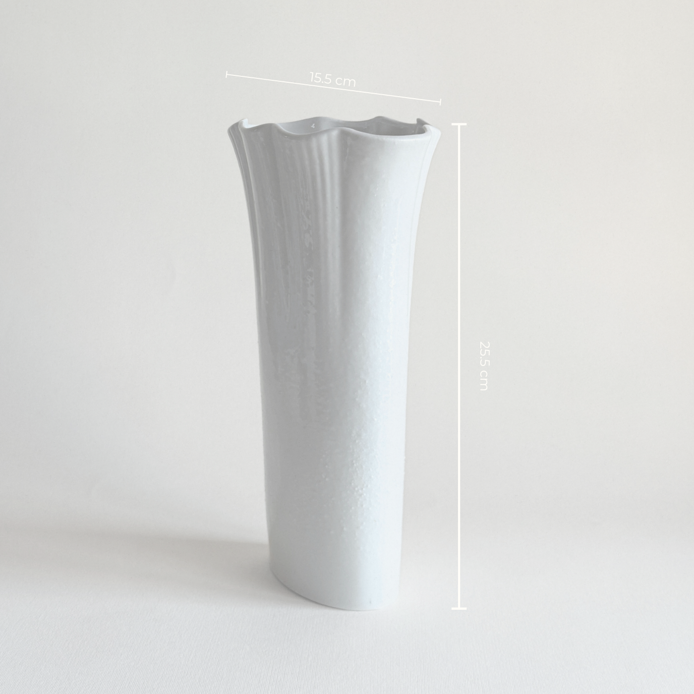 White ceramic vase — additional view showing full profile and glaze condition
