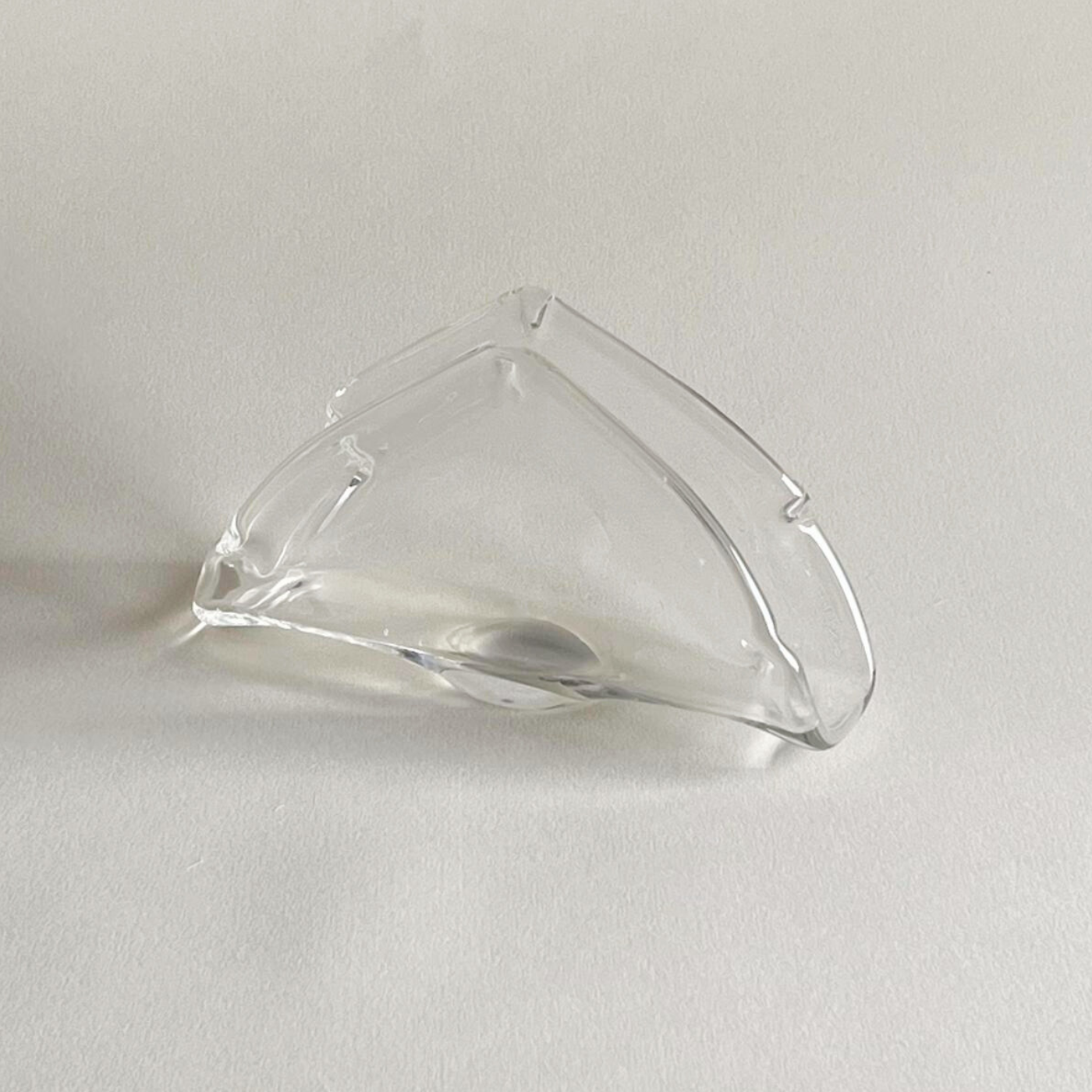 Modern dining table with elegant textured glass napkin holder