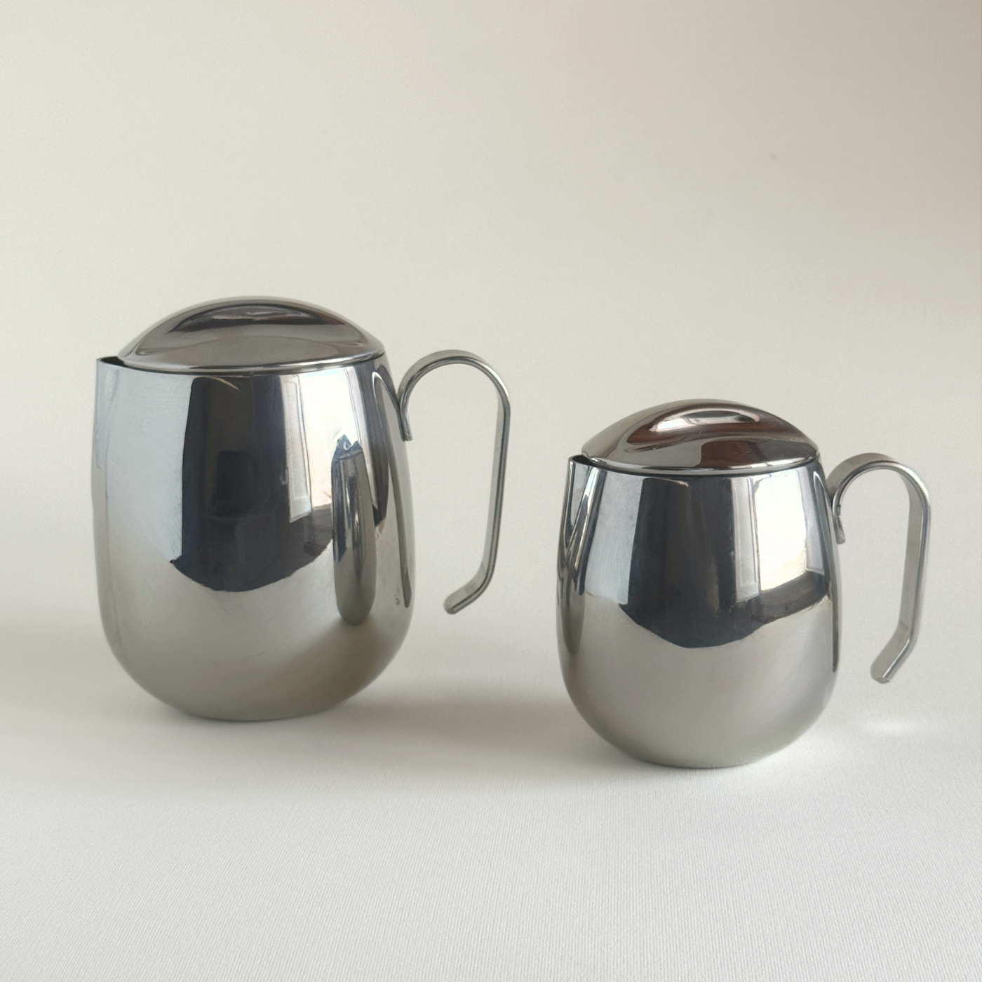 Vintage IMCO stainless steel coffee pot, cylindrical body, side view