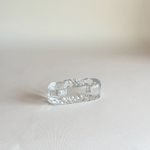 Vintage Iittala candle holder in clear pressed glass, side view showing the low horizontal form