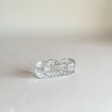 Vintage Iittala candle holder in clear pressed glass, side view showing the low horizontal form