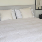 1970s Italian cotton jacquard bedspread with trim edge on bed