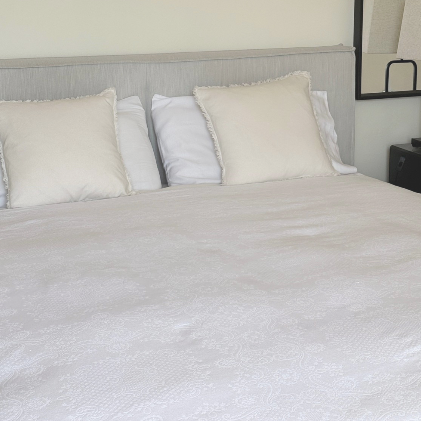 1970s Italian cotton jacquard bedspread with trim edge on bed