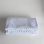 1970s Italian cotton jacquard bedspread with trim edge on bed