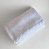 1970s Italian cotton jacquard bedspread with trim edge on bed